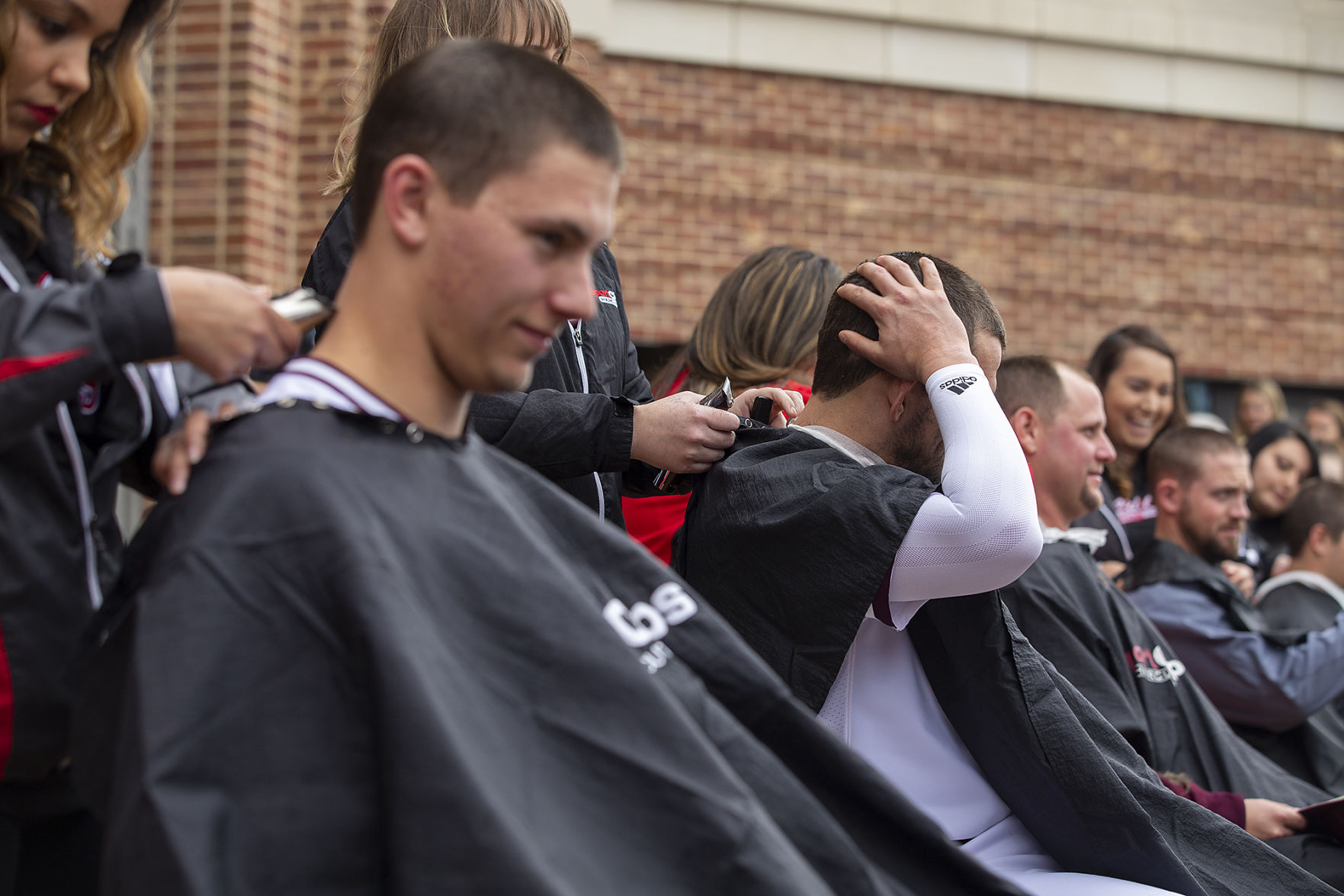 A&M baseball head shaving for cancer